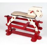 A vintage painted wooden safety rocking horse, approx 100cms long