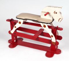 A vintage painted wooden safety rocking horse, approx 100cms long