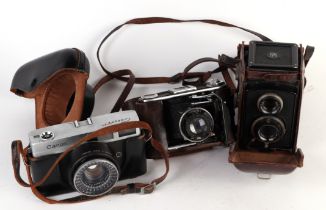 A Franke & Heidecke Braunschweig Compur camera, cased, a Prontor II camera together with a Canon