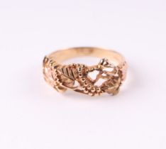 A 9ct rose and yellow gold ring decorated with scrolling grapes and vine, approx UK size 'P', 2.8g.