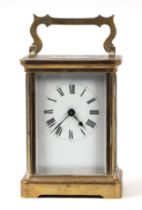 A brass carriage clock, the white enamel dial with Roman numerals, in a four-pillar case, 8cms