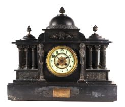 An Edwardian black slate mantle clock, the white dial with Arabic numerals, fitted with an 8d-day