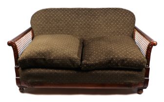 An early 20th century upholstered two seater bergere sofa, 150cms wide.