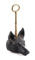 A Victorian style cast iron and brass fox mask door stop, 30cms high. Condition Report Looks to be a