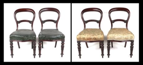 A set of four Victorian mahogany balloon back dining chairs with overstuffed seats and reeded and