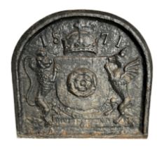 A cast iron fire back with heraldic crest and dated 1571, 71cms wide. Condition Report Probably 19th