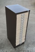 A Triumph bank of filing drawers with fifteen short drawers, 31cms wide.