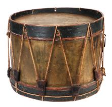 A brass and wooden military marching drum, 40cms diameter.