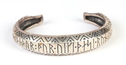 A silver Thor armring bracelet with rune decoration, designed by Alban Depper for Northan Viking