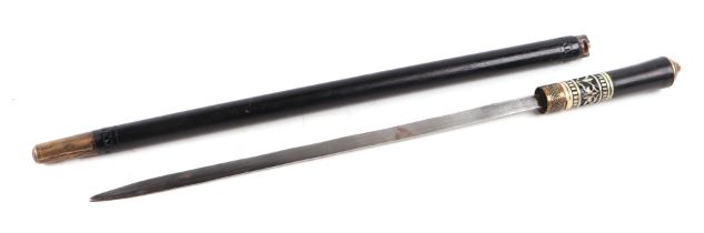 An Indian hardwood swordstick with brass lion mask pommel, 35cms long blade, 58cms long overall.