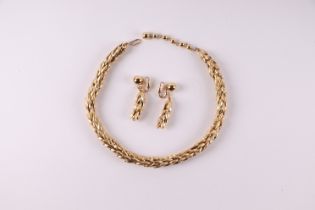 A signed Trifari American gold tone necklace and matching earrings, retailed by Ciro of Bond