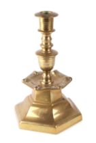 A Flemish 17th century style brass candlestick, 22cms high.