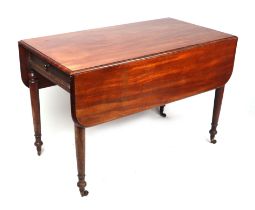 A Victorian mahogany Pembroke table on turned legs, 112cms wide.