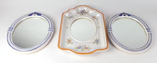 Four faience pottery framed wall mirrors; together with a matching soap dish and towel loop, largest