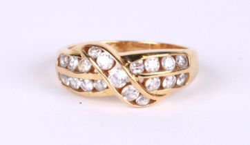 An 18ct gold ring set with white stones, approx UK size 'P', 5.7g.