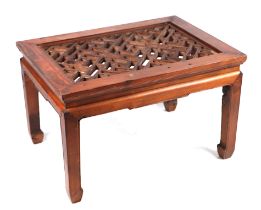 A Chinese stained pine side table with pierced lattice top, 75cms wide.