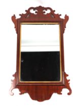 A George II style mahogany fretwork wall mirror, 40cms wide.