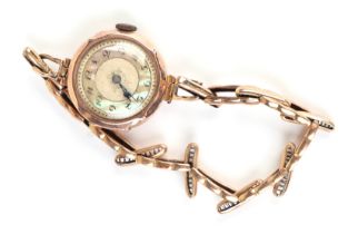 A 9ct gold ladies wristwatch on a 9ct gold expanding strap, the mother of pearl dial with Arabic