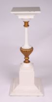 A French Empire style painted column, the pedestal with a stepped square base, 31cms wide, 99cms