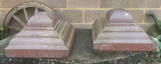 A pair of salt glazed terracotta rectangular stepped capital tops, 46cms wide (2).