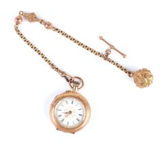 A 14ct gold and enamel fob watch, the white enamel dial with Roman numerals, on a 9ct gold Albertina