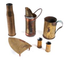 A trench art jug; together with two small trench art vases; and similar items (6)>