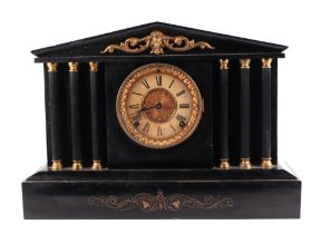 A Victorian mantle clock, the cream dial with Roman numerals and fitted with an 8-day movement, in a