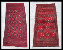 Two small Persian Turkoman woollen hand-made rugs with geometric designs on a red ground, each