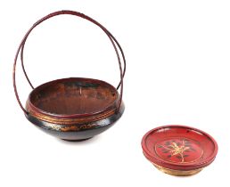 A Chinese lacquer bowl with wicker handle, 32cms diameter; together with a red lacquered dish, 23cms