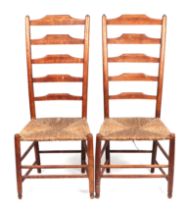 A pair of Philip Clissett Cotswold Arts & Crafts rush seated chairs (2).