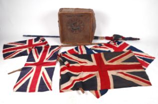 A vintage Union Jack flag, 105 by 65cm; together with four other Union Jack flags on poles; together