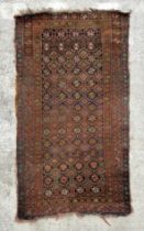 A Persian rug with repeating geometric pattern in a multi border, on a brown ground, 170 by 95cms.