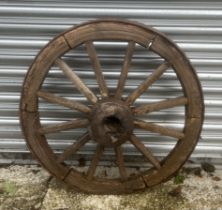 An iron bound cart wheel.86 cm diameter