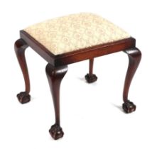 A George III style mahogany stool with upholstered seat on cabriole legs terminating in ball &