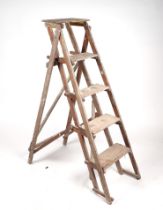 A GPO oak step ladder; together with a rustic barn ladder (2).