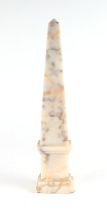 A Grand Tour style veined marble obelisk, 33cms high.