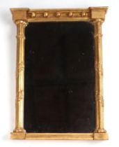 A Regency style carved gilt wood Pier type mirror, 37cms wide.