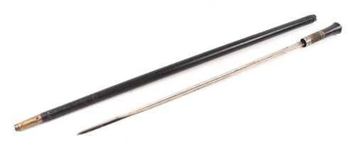 An Indian hardwood swordstick with white metal lion mask pommel and 58cms long blade, 92cms long