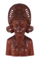 A large Balinese carved hardwood bust, 39cms high.
