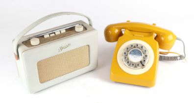 A Roberts Revival transistor portable radio, 24cms wide; together with a vintage spin-dial telephone