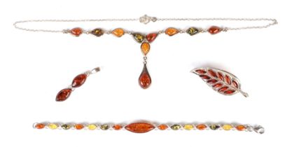 A 925 silver mounted Baltic amber pendant necklace and matching bracelet; together with a similar