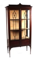 An Edwardian mahogany display cabinet, 83cms wide.
