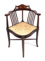 An Edwardian inlaid corner chair with upholstered seat.