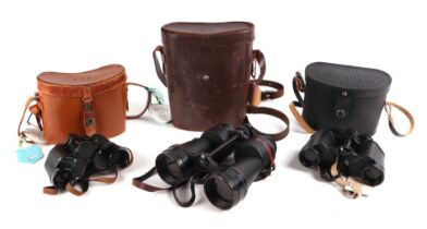 Three pairs of binoculars, all cased, with Racehorse Member's Enclosure tags for Salisbury,