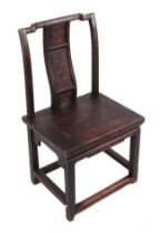 A Chinese stained wooden miniature or child's chair with carved back splat.