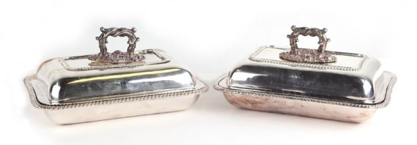A pair of continental silver plated entree dishes and covers with gadrooned rims and cast handles (