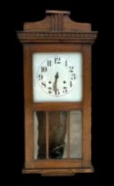 An early 20th century oak cased wall clock, the silver dial with Arabic numerals, 75cm high.