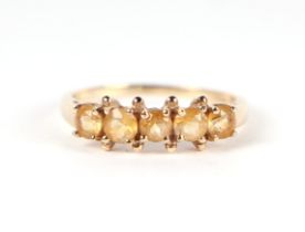 A 9ct gold five stone citrine ring, approx UK size 'O', 1.4g.