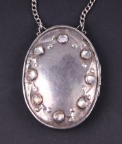 A Victorian silver and moonstone locket on chain, marks rubbed and indistinct, 33g. Condition Report