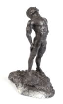 A cast lead figure of a male nude, 19cms high. Condition Report In general good condition.